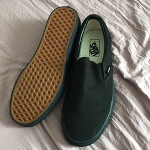 Solid Black Vans slip-ons